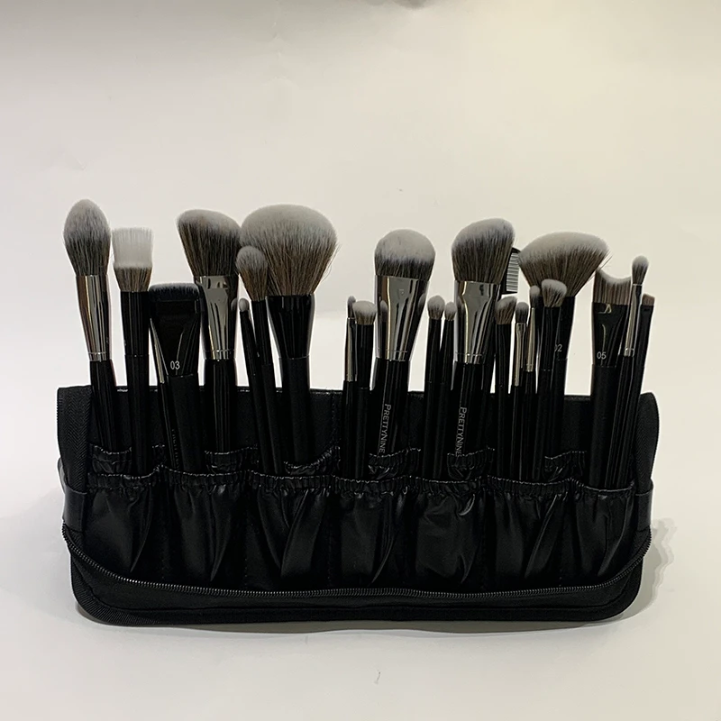 Front view of the BS-1 folding makeup brush bag standing upright with a mixed brush assortment