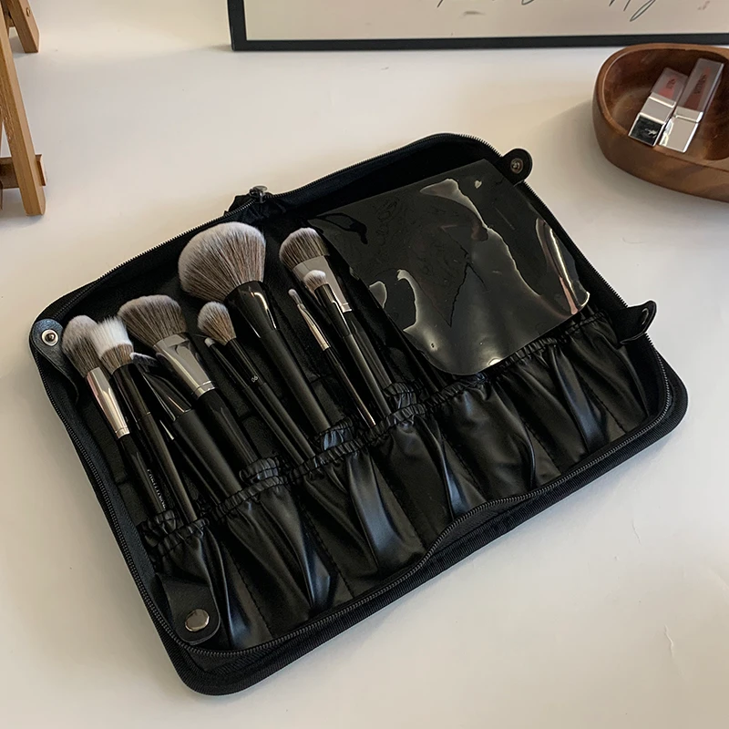 BS-1 brush bag opened flat with the soft PVC flap covering part of the loaded brush area